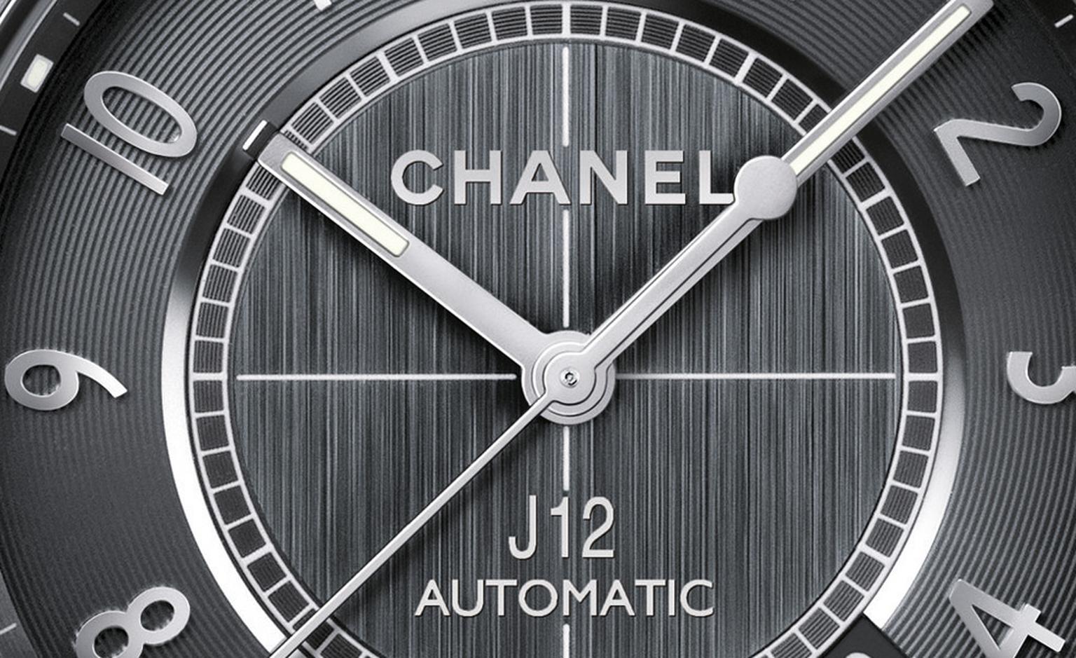 Close-up of dial of the Chanel J12 Chromatic watch. Self-winding mechanical movement. Functions: hours, minutes, seconds, date. 42-hour power reserve. Unidirectional rotating bezel. Screw-down crown, water-resistance 200 meters. 41mm diameter
