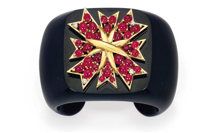 Lot 31. A diamond, ruby, onyx and gold cuff, by Verdura. Estimate 20,000 - 30,000 U.S. dollars. SOLD FOR $32,500