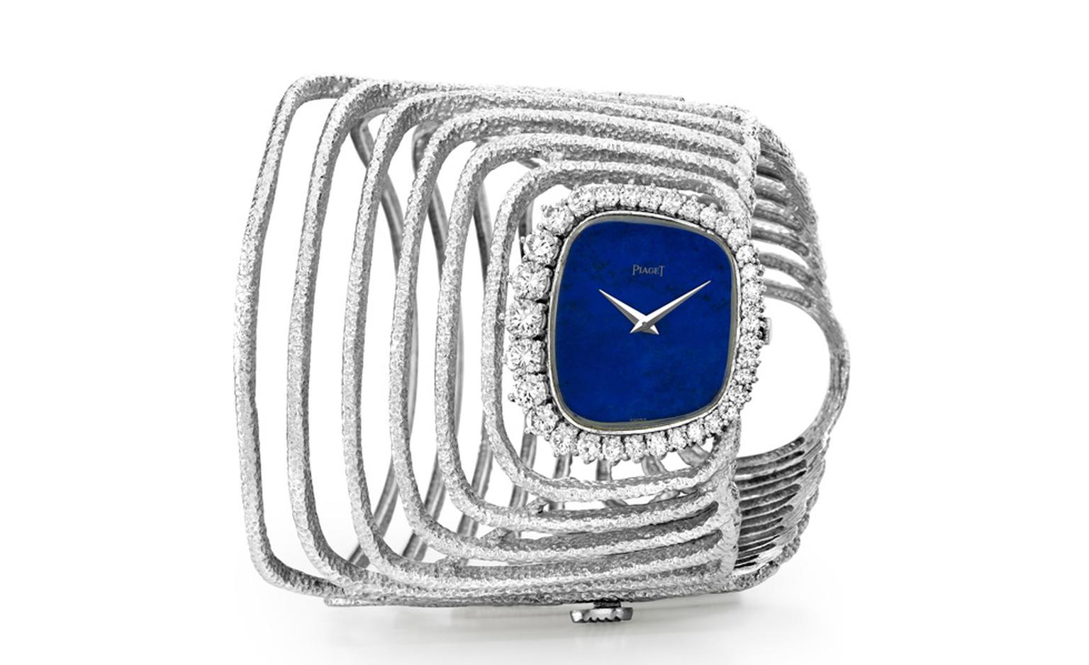 Piaget Cuff 1970 watch in white gold with lapis lazuli dial and bezel set with diamonds.  Piaget ultra-thin hand wound 9P movement. Piaget Private Collection.