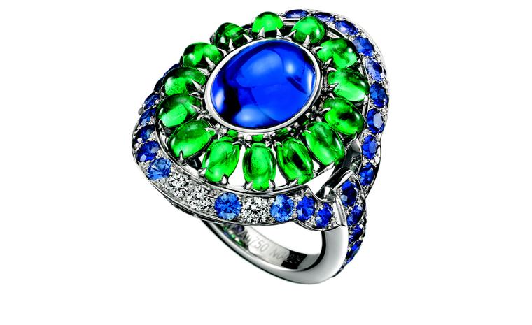 BOUCHERON. Capriccioli ring, set with an oval cabochon sapphire, paved with emerald beads, blue and purple sapphires and diamonds, on white gold. POA