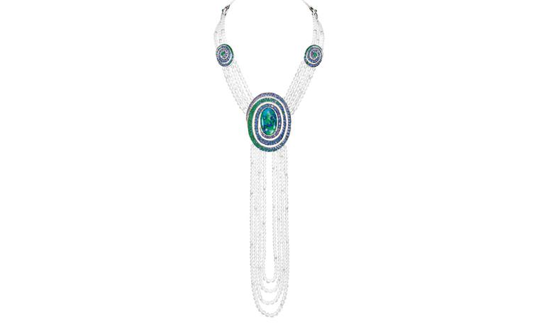 Boucheron Aiguebelle  necklace, set with an oval opal cabochon and rock crystal beads, paved with emeralds, blue and purple sapphires and diamonds, on white gold. The rock crystal swag is detachable. POA