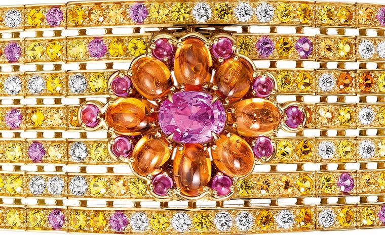 Boucheron close up of the Isola Bella   watch   bracelet,   set   with   a   pink   oval   sapphire   and   pink   and   orange   cabochon       sapphires,   paved   with   yellow,   pink   and   orange   sapphires,   emeralds   and   diamonds, ...