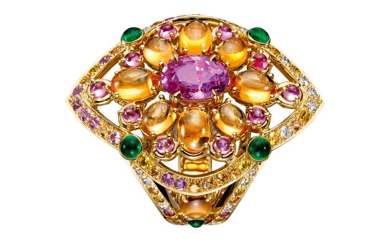 Boucheron Isola  Bella  ring,  set  with  an  oval  pink  sapphire,  paved  with  yellow,  orange  and  pink  sapphires   and  diamonds,  on  yellow  gold. POA