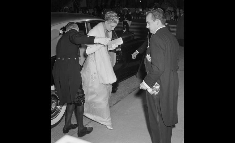 Prince Ranier and actress Grace Kelly arrive for a gala performance at the Royal Opera House April 18th after their civil wedding ceremony earlier in the day.  The actress wore a Cartier sparkling tiara and a diamond and ruby necklace presented ...