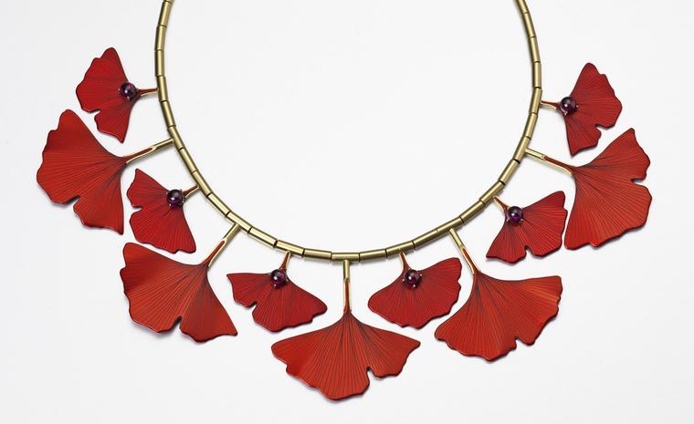 Ginkgo Necklace by Roger Doyle made from 18ct yellow gold set with Rhodonite garnets mounted on photo etched red anodized aluminium.   £3500