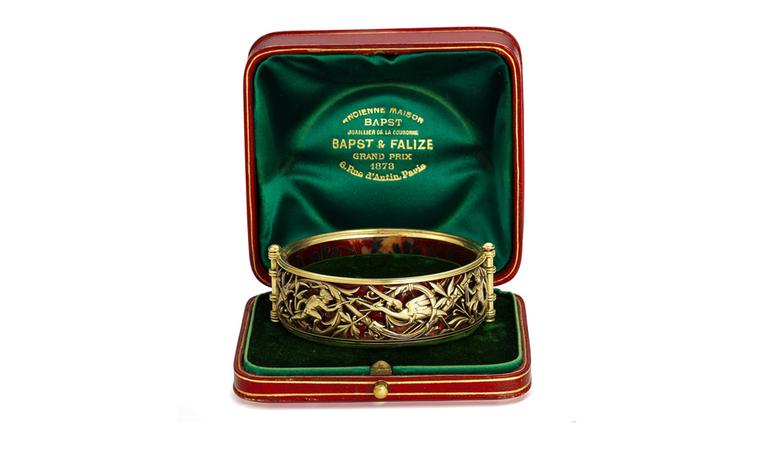 Lot 27. A gold and enamel bangle, by Bapst & Falize, circa 1885. Estimate £6,000-8,000. SOLD FOR ££8,750.