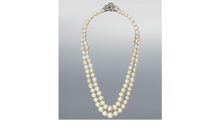 Lot 197. A double-row natural pearl necklace with diamond clasp. Estimate £70,000-90,000. SOLD FOR £253,250.