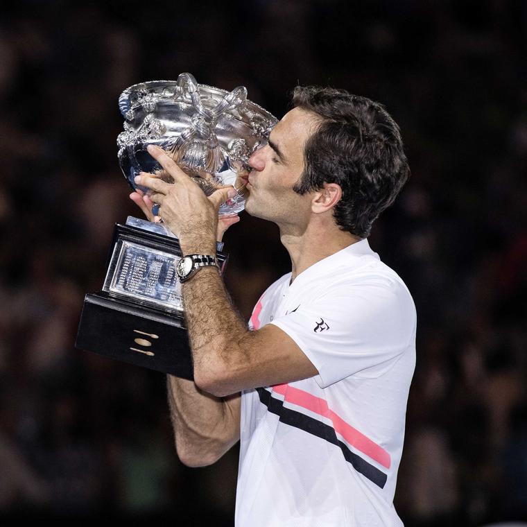 Roger Federer with the Australian Open 2018 trophy on 29 January 2018 wearing his Rolex SkyDweller