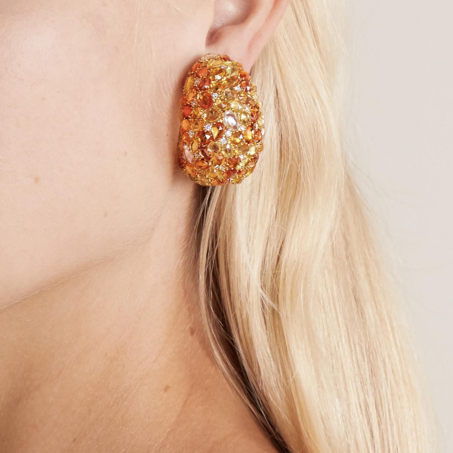 Sapphire and diamond earrings by Lorraine Schwartz on model