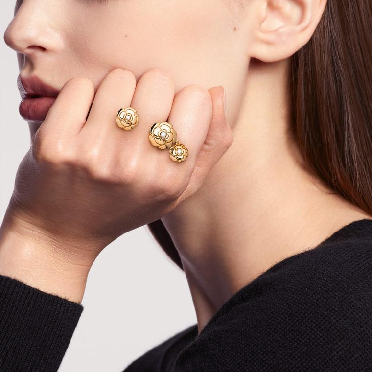 Chanel extrait de camelia charms ring on model