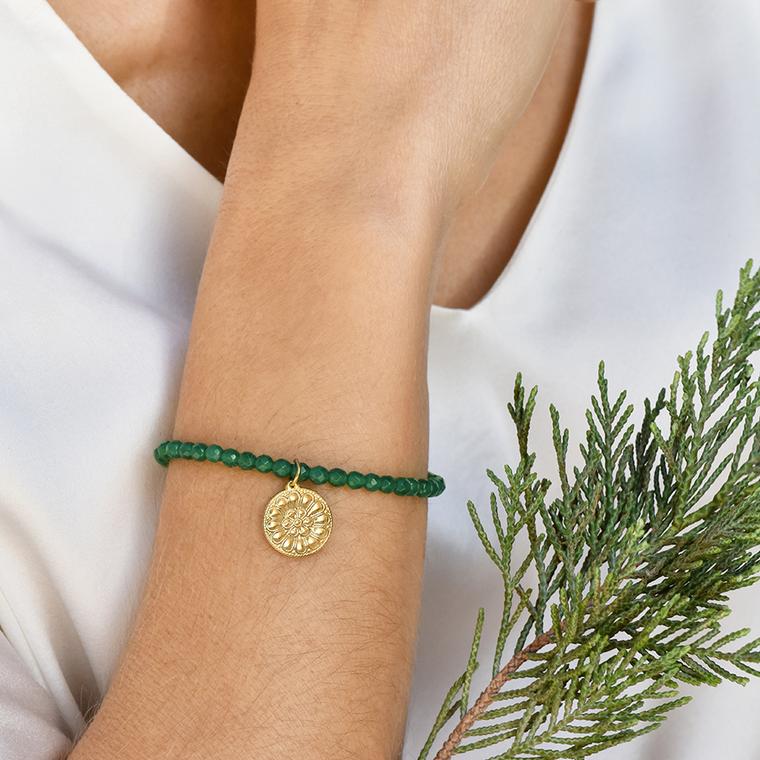 Bracelet with faceted green agate beads and gold motif by Lalaounis on model