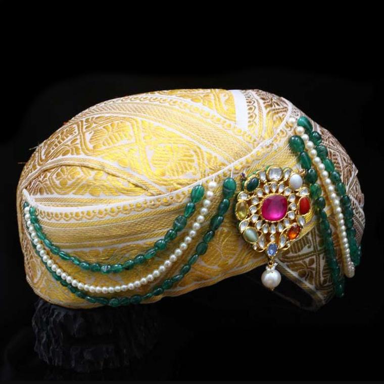 A Navratna turban with its sacred combination of nine gemstones by C. Krishniah Chetty and Sons.