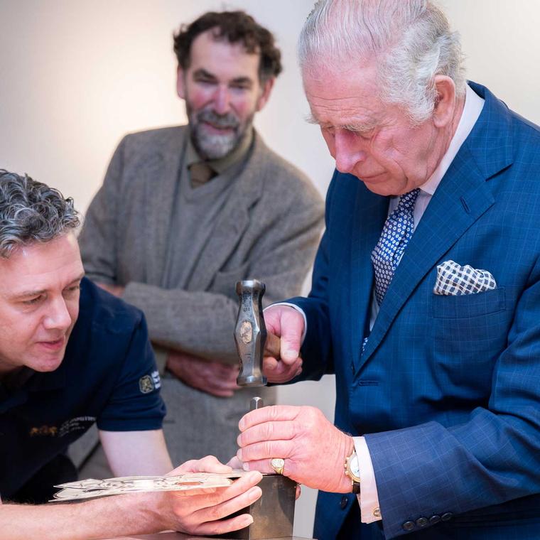 King Charles III hallmarking the King's Mark on a silver Cross of Wales Photographer - Julia Skupny