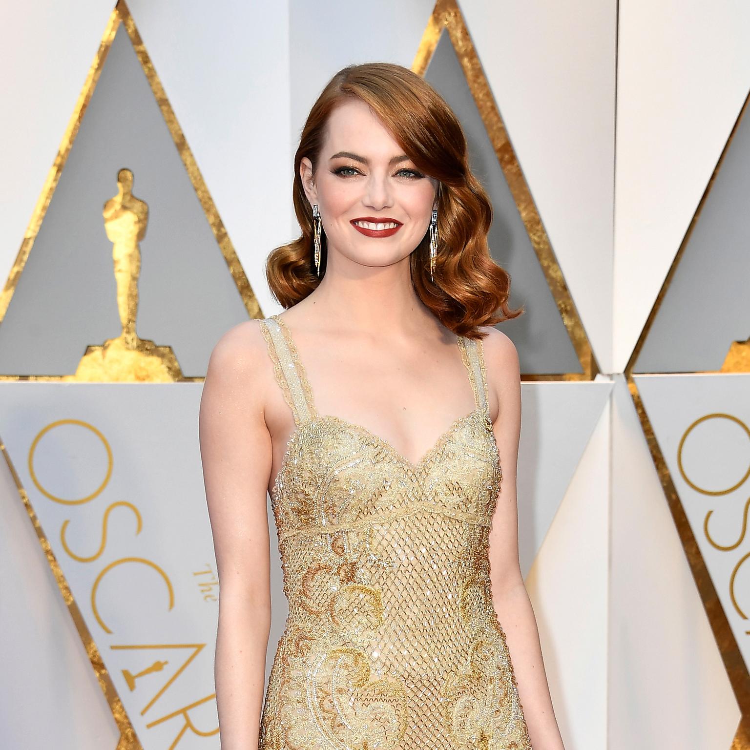 Emma Stone on the Oscars red carpet wearing Tiffany Whispers of the Rain Forest earrings from the 2017 Book Collection 