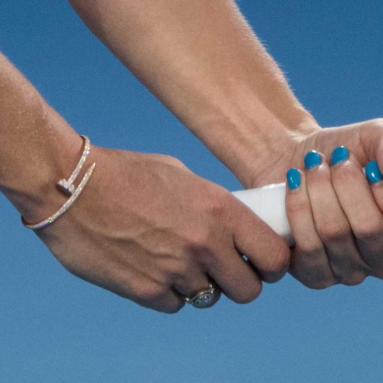 Close-up of Caroline Wozniacki at the Australian Open 2018 wearing a gold, diamond-set Cartier Juste une Clou bracelet