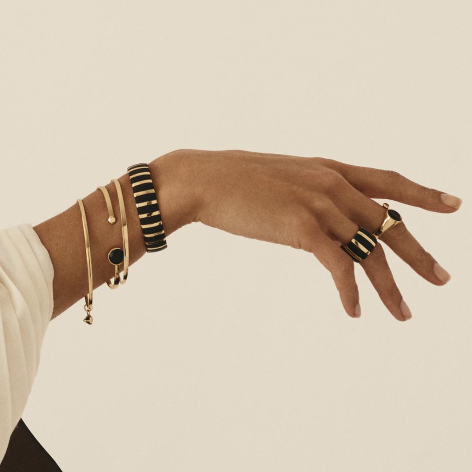 Mpingo wood bangle, bracelet and rings by Kinraden on model