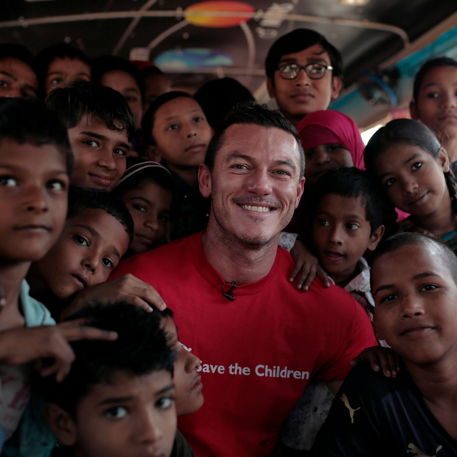 Luke Evans with pupils in India raising money for Save the Children