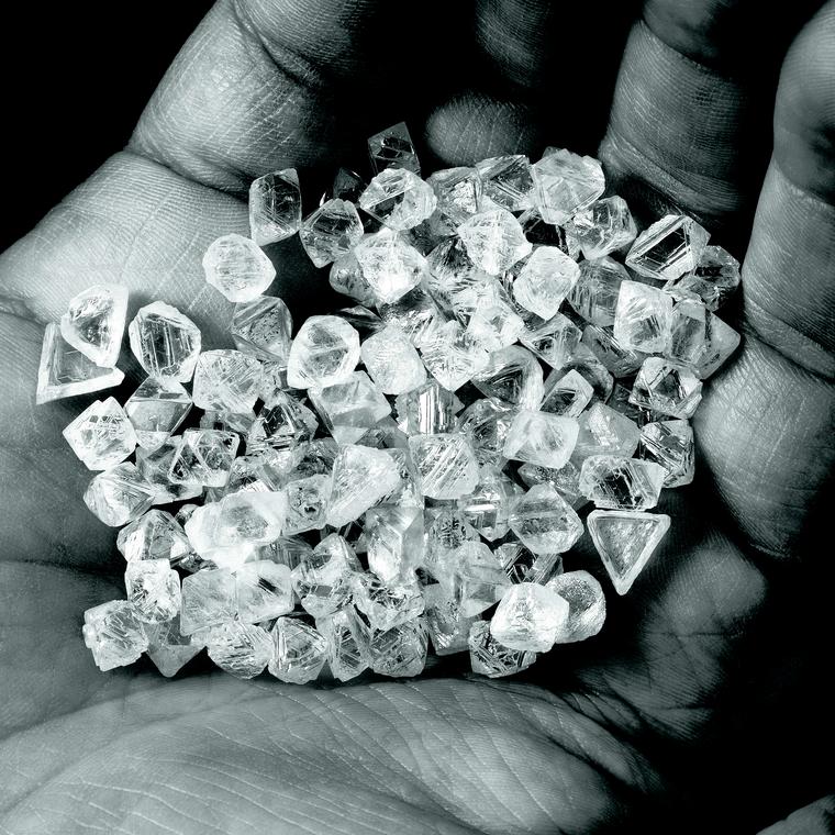 Rio Tinto rough white diamonds in hand