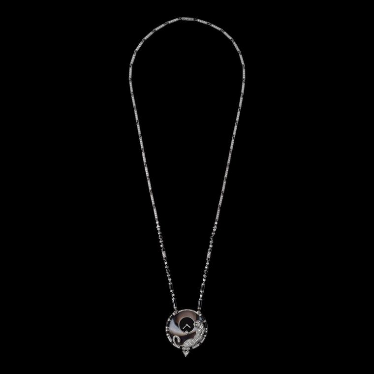 Cartier’s Panthère Mystérieuse pendant watch plain background