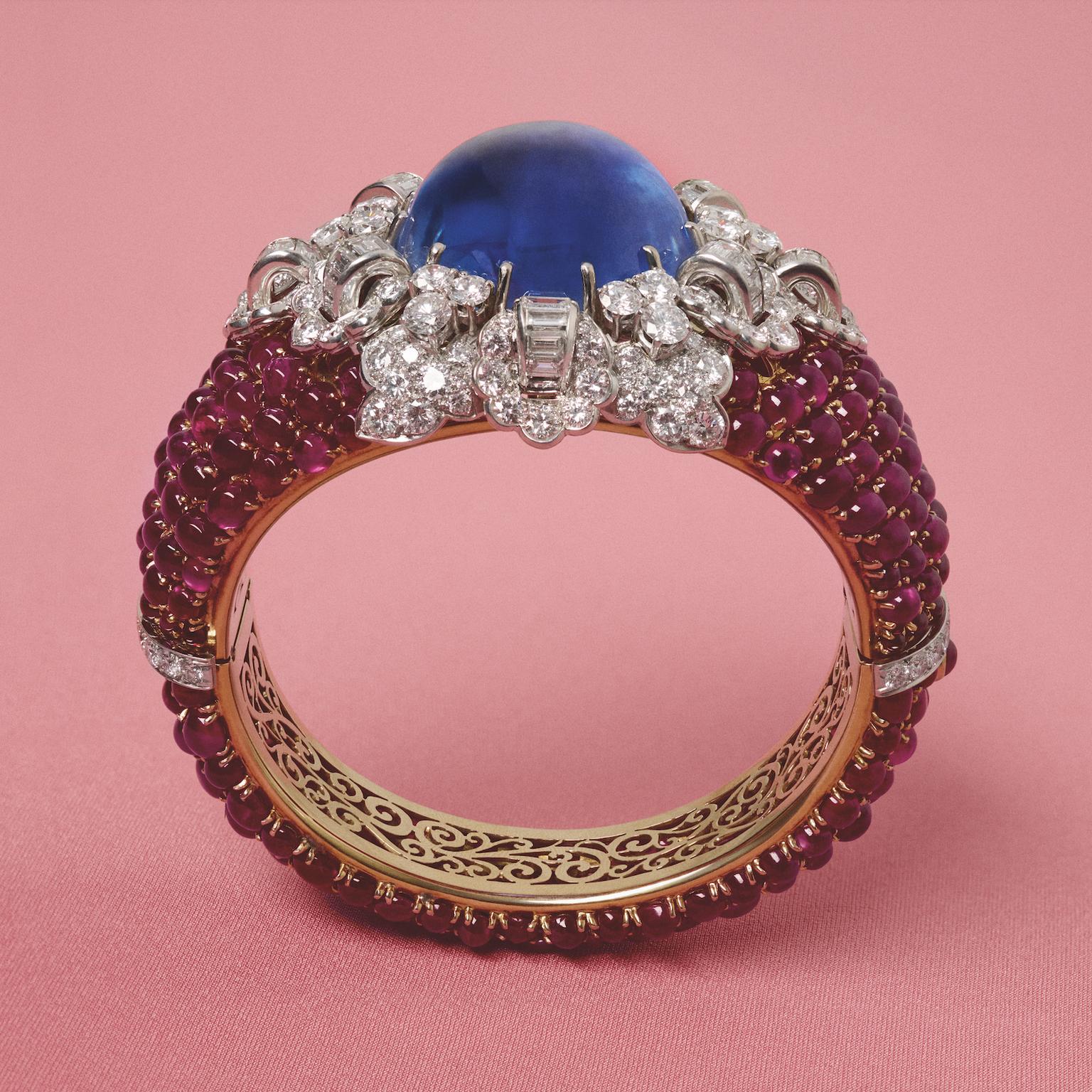 Platinum bangle set with a cabochon sapphire, rubies and diamonds (1954) by Bvlgari
