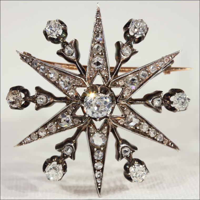 Antique brooches Victoria Sterling silver-topped gold star pin with diamonds