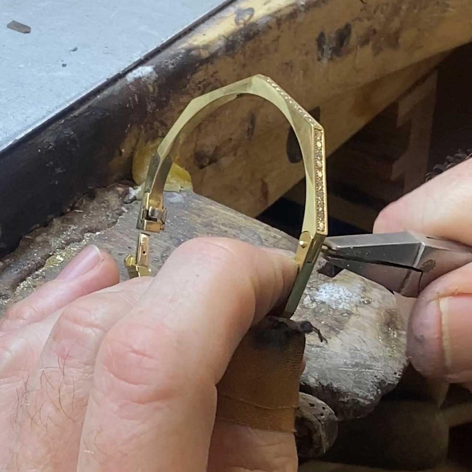 Hirsh Story yellow gold and diamond bangle in workshop
