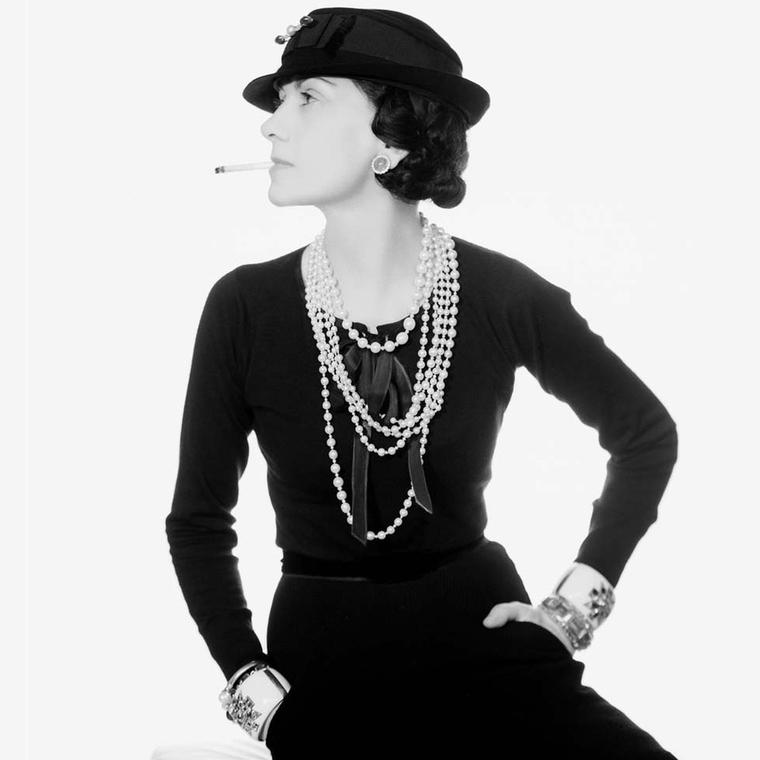 The legendary Coco Chanel, both a friend and muse to Fulco di Verdura, pictured in one of her most iconic photographs wearing her Maltese cuffs.