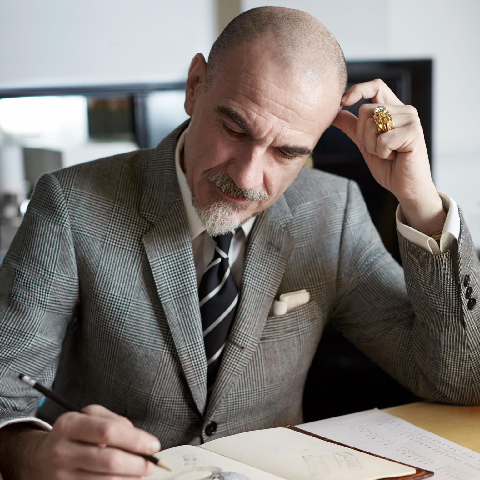 Giampiero Bodino sketching at his desk