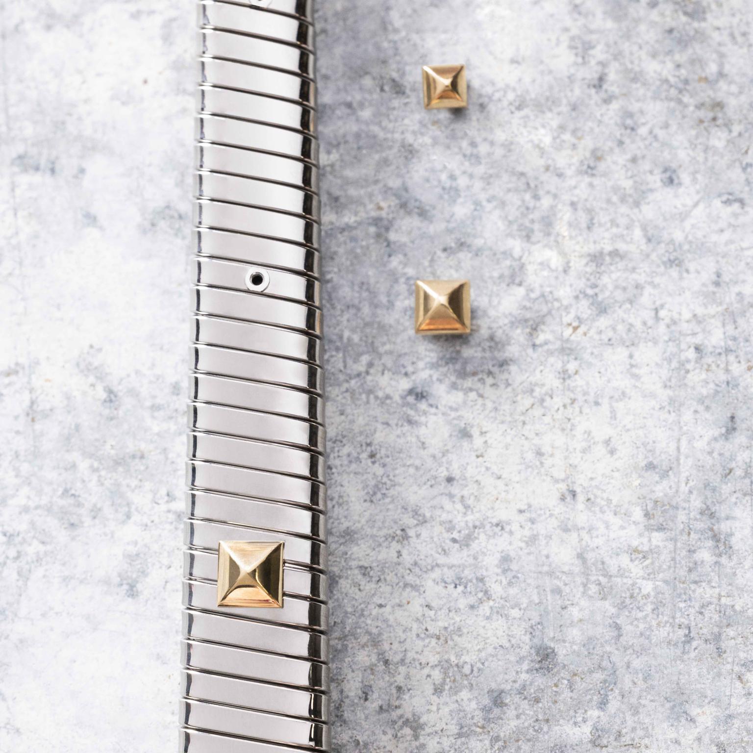 Setting of gold studs on a  Serpenti Tubogas bracelat by Bvlgari