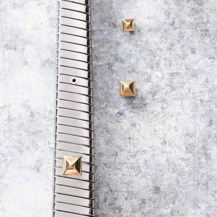 Setting of gold studs on a  Serpenti Tubogas bracelat by Bvlgari