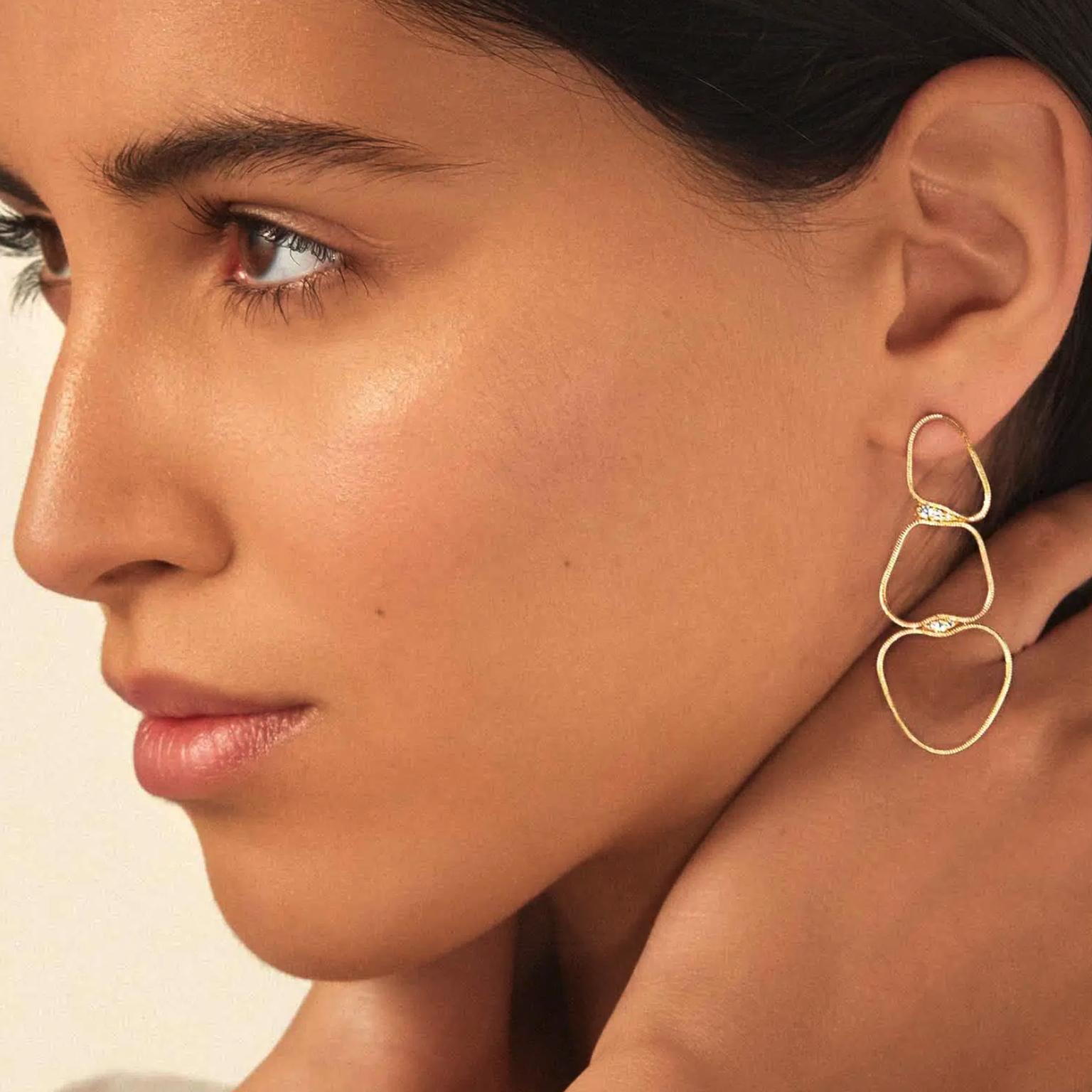 Earrings by Fernando Jorge on model