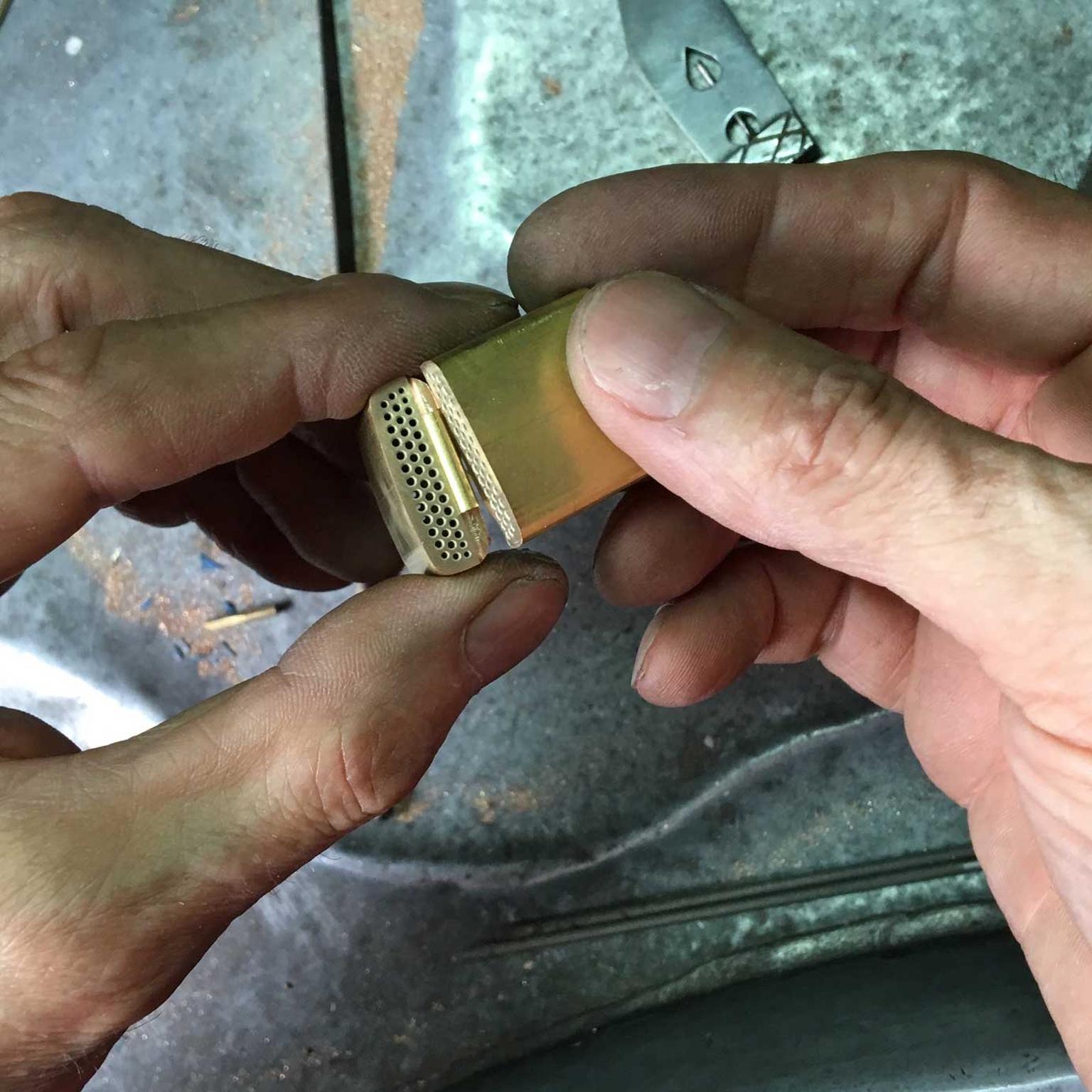 GGoldsmith at work on a Vhernier Carré bracelet that is entirely hand made by one skilled artisan.