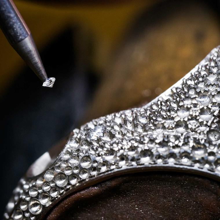 Setting diamonds in watch top