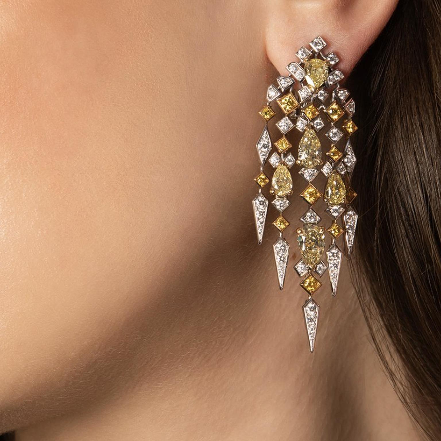 Yellow and white diamond earrings by David Morris on model