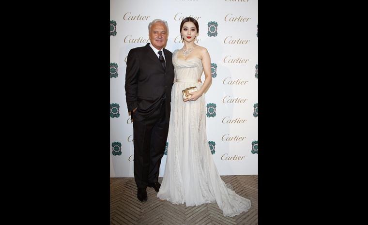President and CEO of Cartier International, Bernard Fornas with Chinese singer and actress Fan Bingbing September 2011 at launch of Sortilège de Cartier jewellery collection.