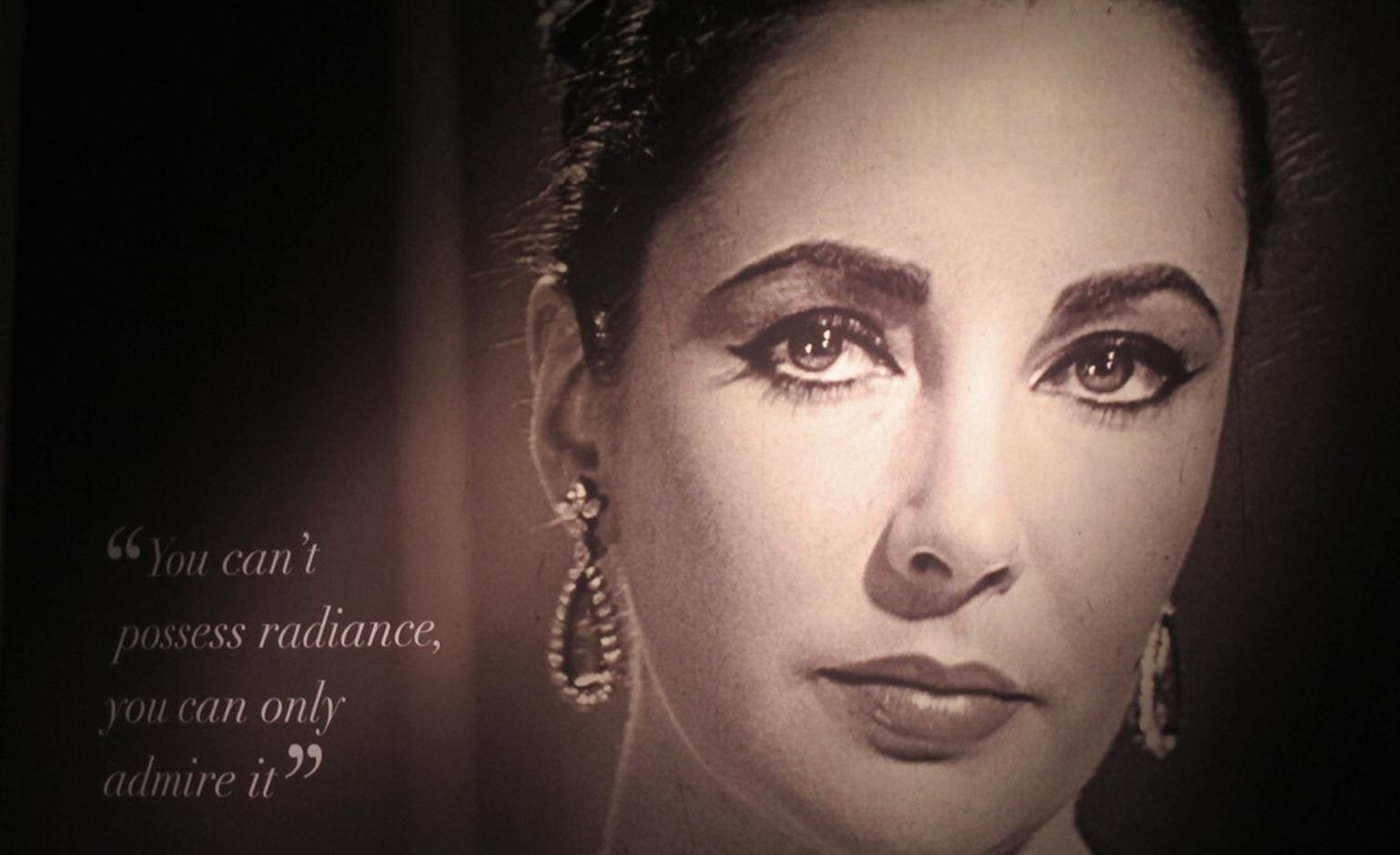 Poster of Elizabeth Taylor at the Christie's exhibition of her jewels, art and couture that is touring the world before the December sale in New York.