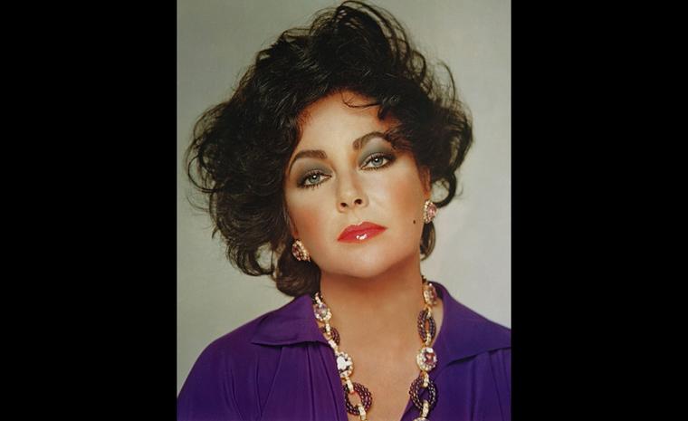 Elizabeth Taylor looking very 80's wearing one of her Van Cleef & Arpels favourites, the Kunzite necklace