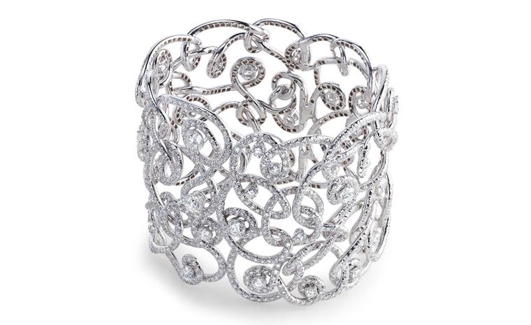 Fabergé Carnet de Bal Mazurka bangle, named for the dance fashionable during Fabergé Russia. Single diamonds are surrounded by swirling ribbons of gold and more diamonds. POA
