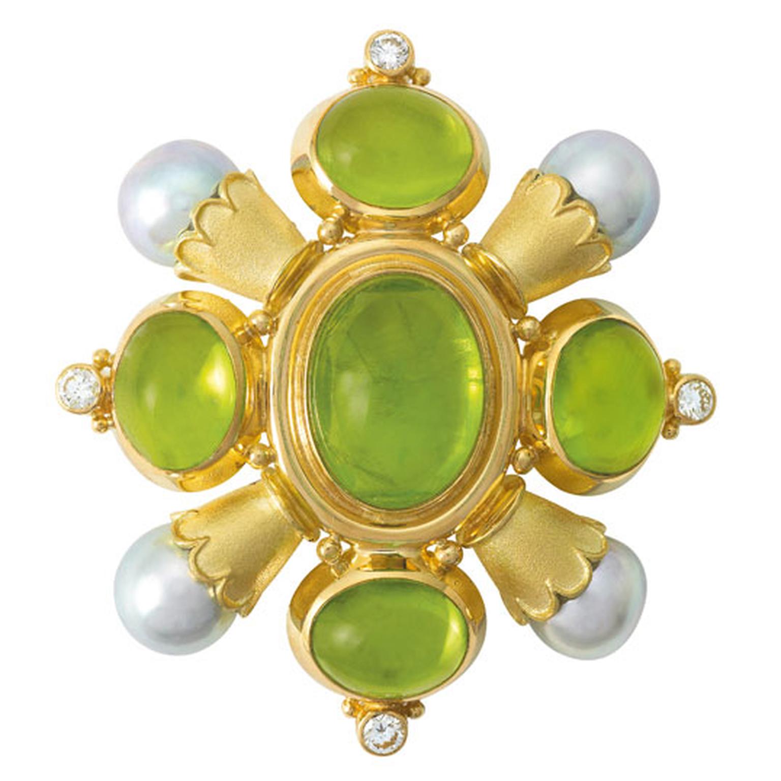 ELIZABETH GAGE, Kiss Pin, A gorgeous set of oval cabochon peridots, cultured akoya pearls in scallop edged gold funnels with diamonds and decorative gold bead detail. £15,600