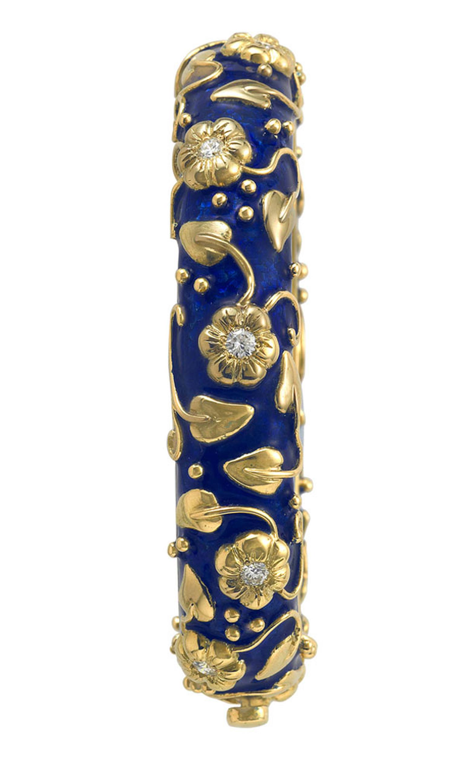 ELIZABETH GAGE, Royal Blue Bangle decorated with gold flower motifs set diamonds, gold carved leaves, twining stems and bead detail. POA