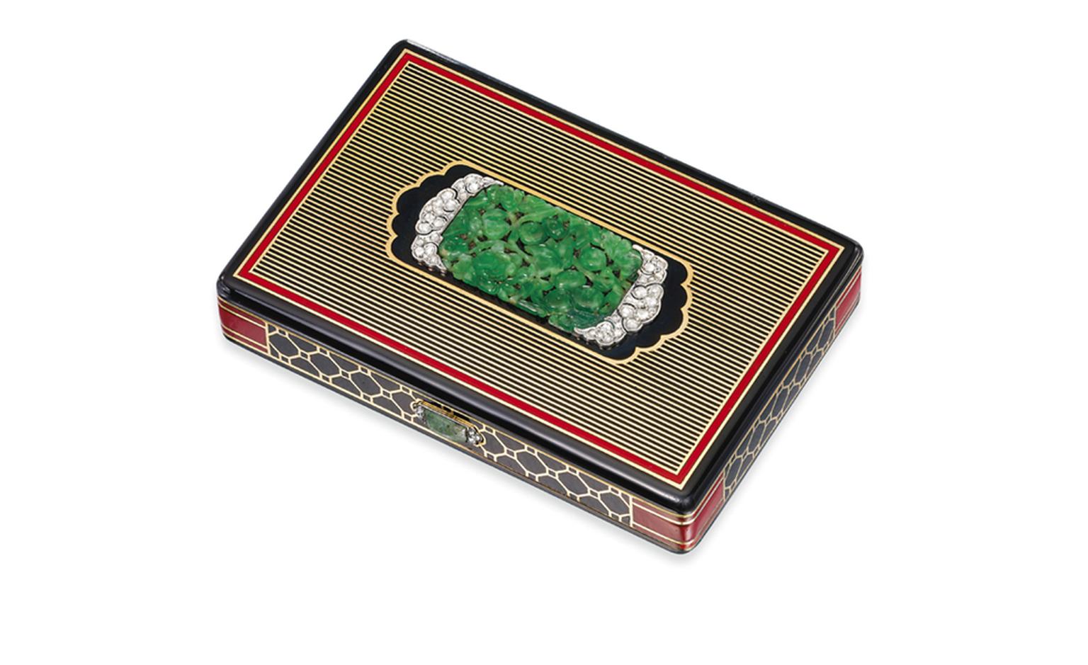 Lot 112. An art deco jade, diamond and enamel vanity case, by Cartier. Estimate £3,000-£4,000. SOLD FOR £27,500