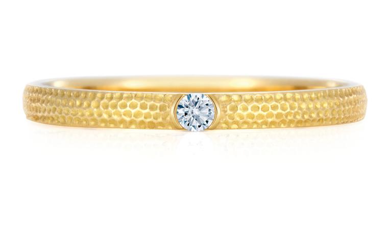 DE BEERS. Azulea Band, white diamond on yellow gold 0.03 carat weight. Price from £600.