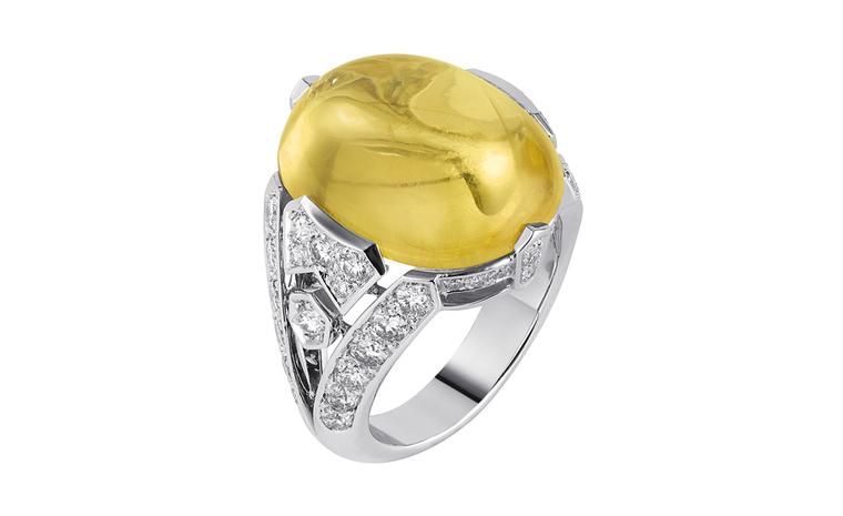 Sortilège de Cartier platinum ring with one cabochon-cut yellow sapphire with brilliant-cut diamonds.