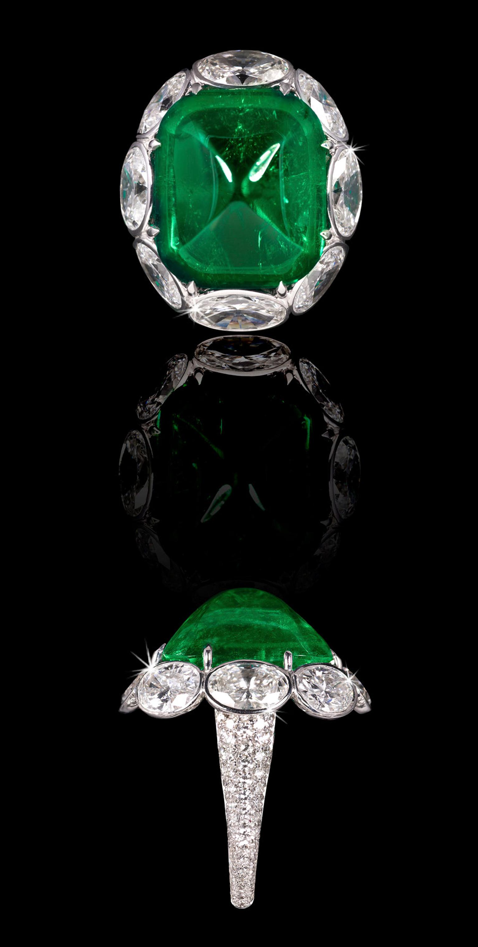 Emerald-Ring-With-White-Oval-Diamond-Surround.jpg