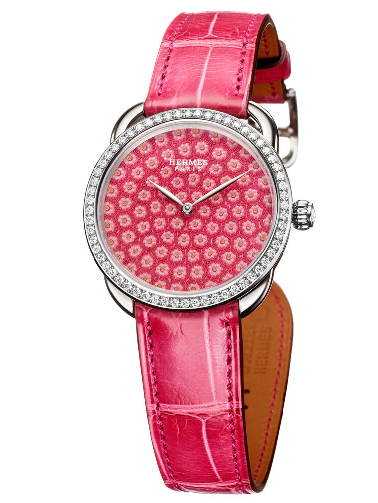 Hermès' Arceau Millefiori watch is decorated with thousands of miniature pink glass flowers crafted by Les Cristalleries de Saint-Louis in France, the same company that has been blowing life into glass paperweights since 1586.