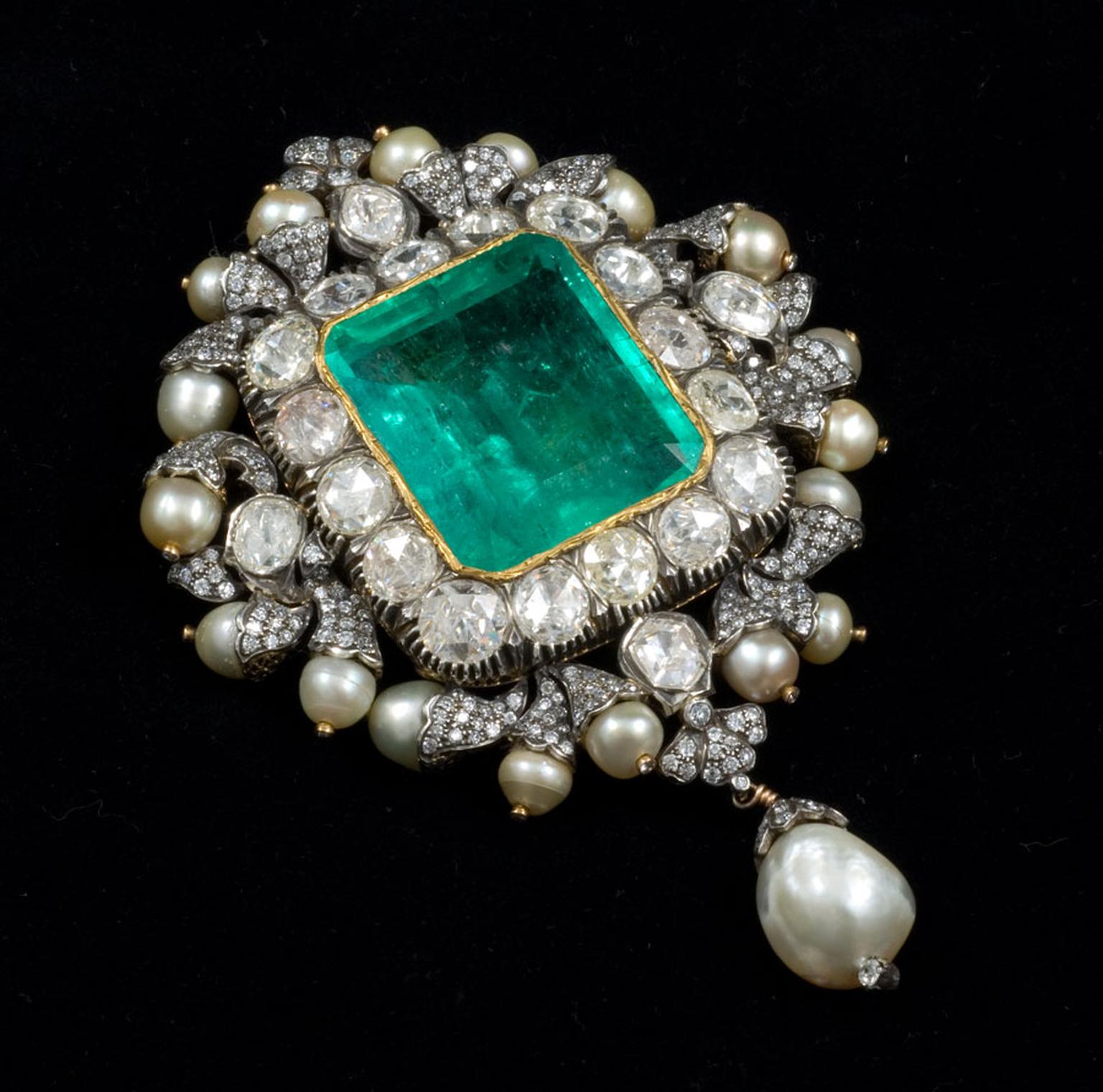 Gem Palace Sanjay Kasliwal-designed brooch with a central emerald, which doubles up as a pendant.