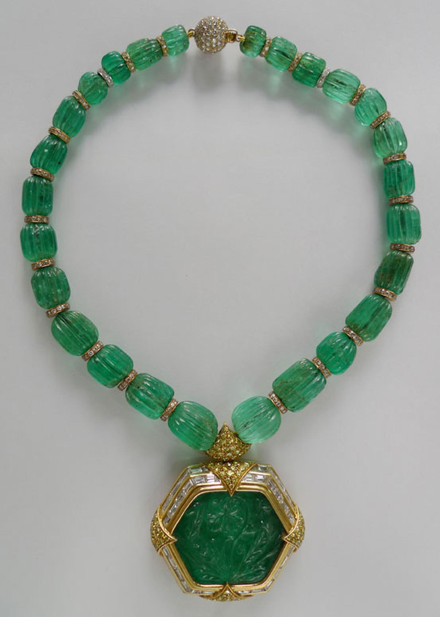 Gem Palace emerald necklace featuring a central carved emerald.