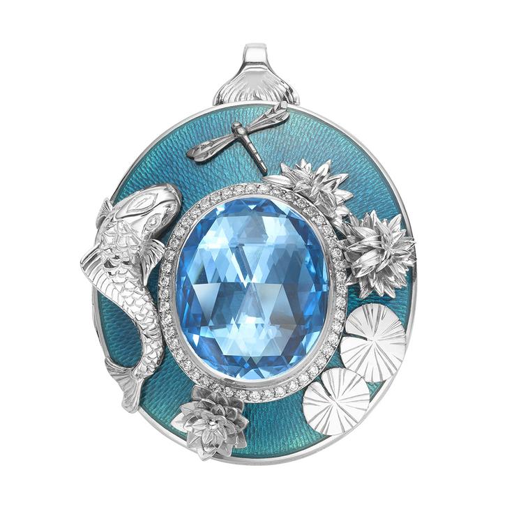 This 18ct white gold and enamel Theo Fennell locket pays homage to the Koi Carp. The front showcases a sea-blue 29.13ct topaz surrounded by diamonds and sealife, while the is engraved with a Koi Carp.
