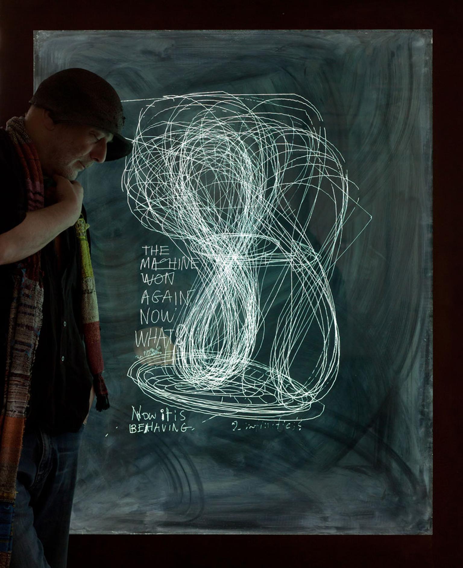 Ron Arad next to his 'Last Train' glass sketching