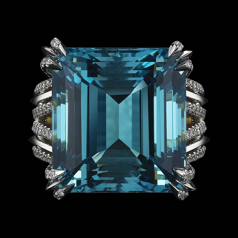 A front view of the stepped 58-facet Asscher cut aquamarine in Alexandra Mor's latest creation, which refracts light through the stone, revealing its inner depths.